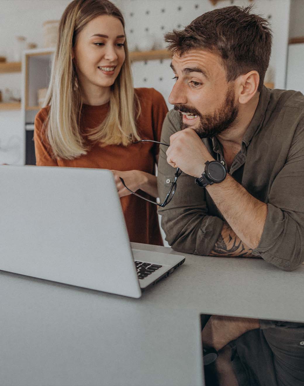 Couple holding a video conference on a laptop.